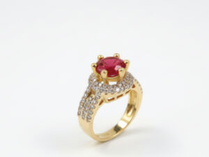 GOLD PLATED RING WITH A RED STONE