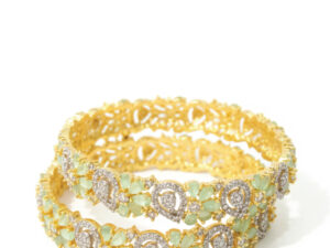 AMERICAN DIAMOND  ZIRCON  WITH AQUA MINT STON ON THE BASE OF GOLD